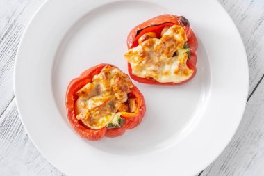 Baked bell peppers stuffed with sausage and topped with mozzarella