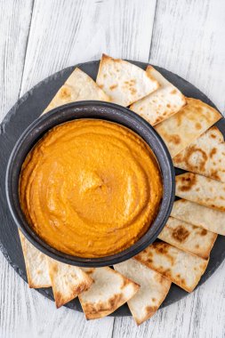 Bowl of classic Muhammara with pita bread