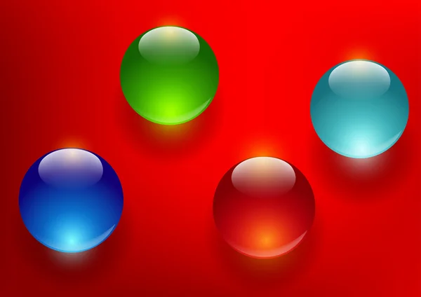 Bolas de vidro coloridas em um fundo vermelho — Fotografia de Stock