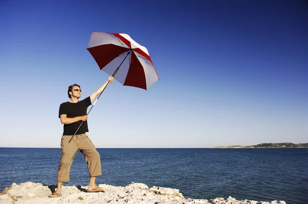 Man With Umbrella At The Beach — Stock Photo, Image