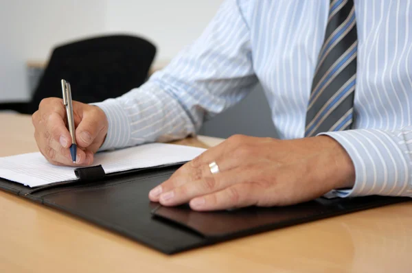 Close-Up Of Writing Hands In Business Environment Royalty Free Stock Images