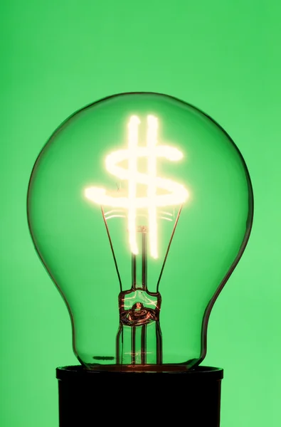 Light bulb with glowing dollar symbol — Stock Photo, Image