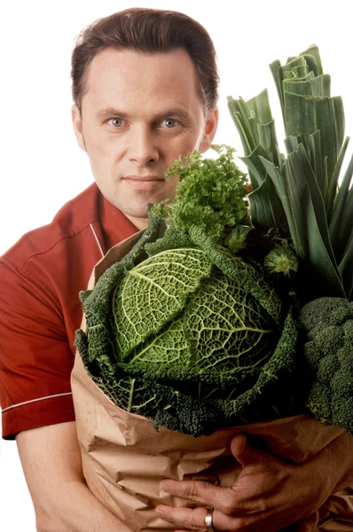 Man holding bag full of vegetables — Stock Photo, Image