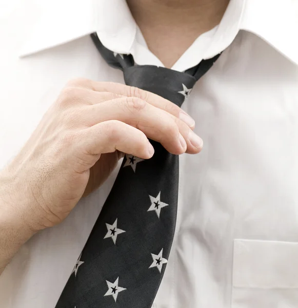Business man getting ready for work, fixing his tie — Stock Photo, Image