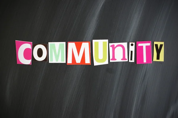 "Wspólnoty "litery na Chalkboard — Zdjęcie stockowe