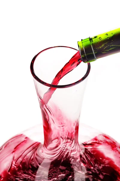 Red wine being poured in a decanter — Stock Photo, Image