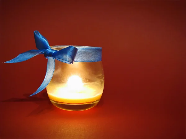 Candle in glass bottle — Stock Photo, Image