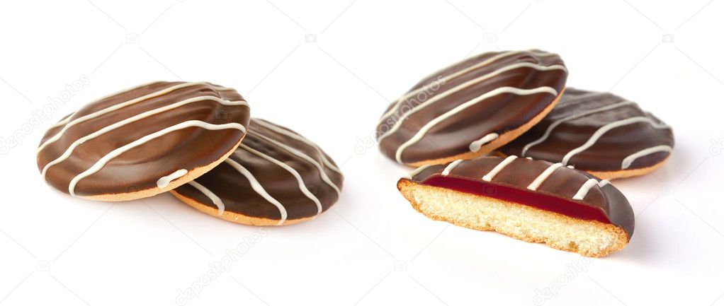 Sweet cookies with cherry jam and chocolate icing isolated on wh