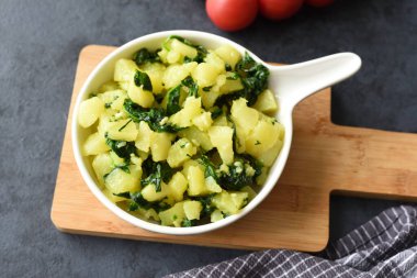 Boiled potatoes with spinach, garlic, and olive oil