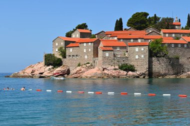 Sveti Stefan, Montenegro - June 6, 2022: Sveti Stefan small islet and 5-star hotel resort on the Adriatic coast of Montenegro