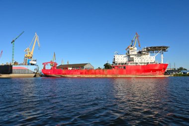 Ship under repair in the shipyard.View of the port channel