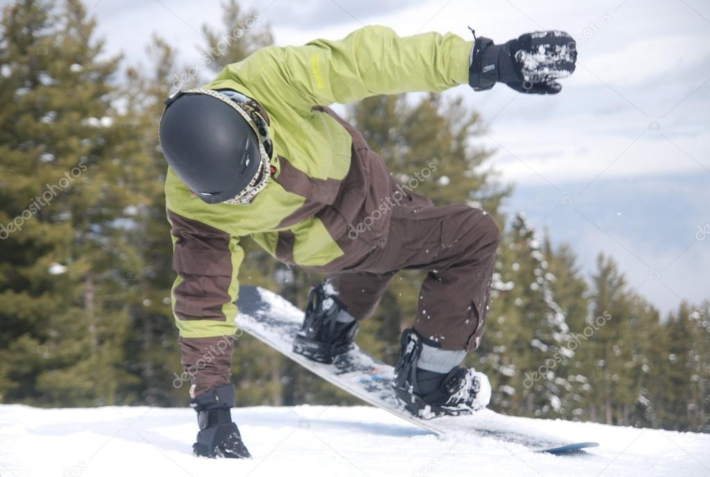 Snowboarder feint before descending the mountain at the ski resort of Bansko in Bulgaria