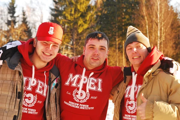 Company of young guys posing on a sunny winter day — Stock Photo, Image