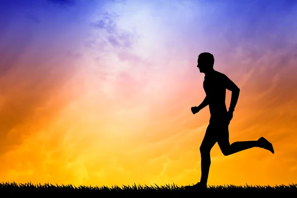 Man running at sunset — Stock Photo, Image