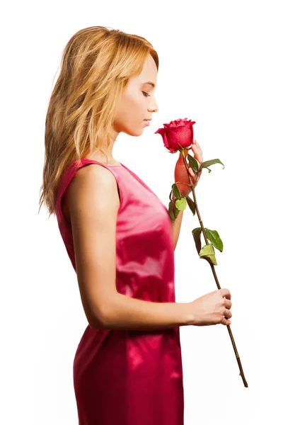 Attractive blonde woman holding a flower — Stock Photo, Image