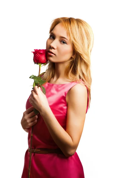 Attractive blonde woman holding a flower — Stock Photo, Image