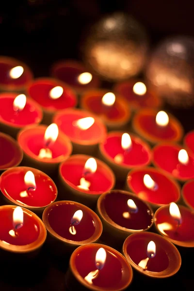Candles burning in the dark. — Stock Photo, Image