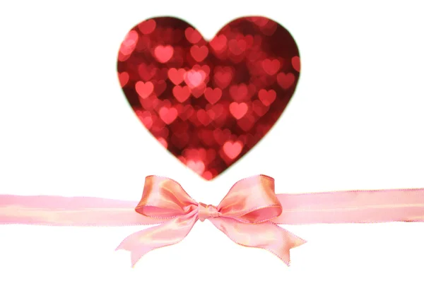 Glossy pink bow and heart shape by little heart, on white background. — Stock Photo, Image