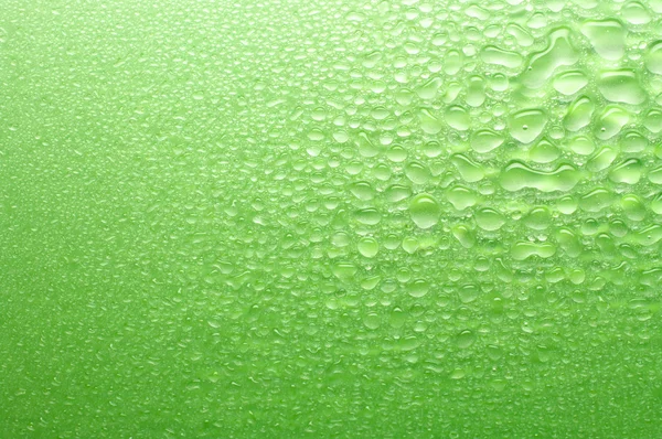 Varios tamaños gotas de agua verde . — Foto de Stock