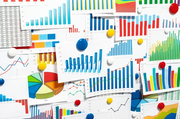 Sticking up many graphs and charts. — Stock Photo, Image