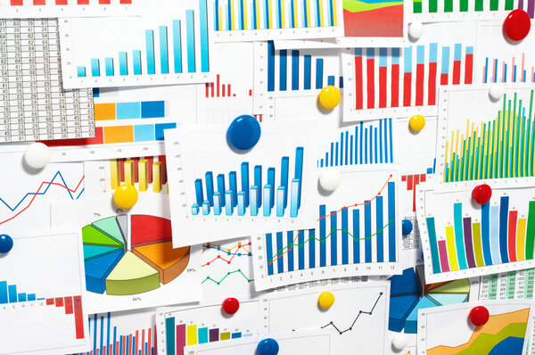 Sticking up many graphs and charts.