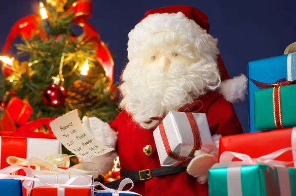 Santa Claus preparing Christmas presents. (horizontal) — Stock Photo, Image