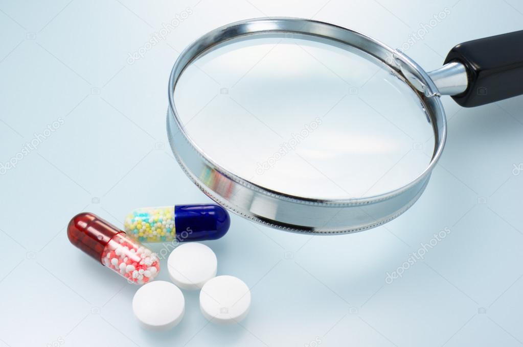 Medicines and magnifier.