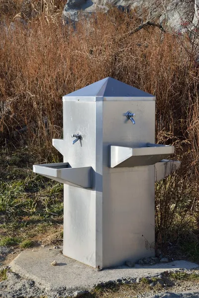 Steel Made Water Fountain in field — Stock Photo, Image