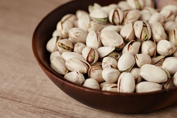 Tasty Pistachio Nuts Bowl Wooden Table Side View Space Text Royalty Free Stock Images