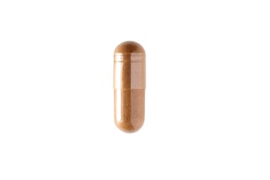 Closeup of the brown capsule. Isolated pill