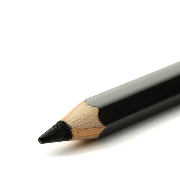 Schwarzer Bleistift auf weißem Hintergrund — Stockfoto