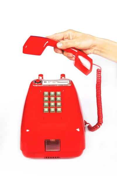 Fehér háttér piros régimódi telefon — Stock Fotó