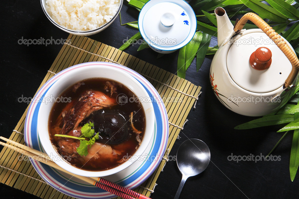 Stew pork leg with rice and soup.