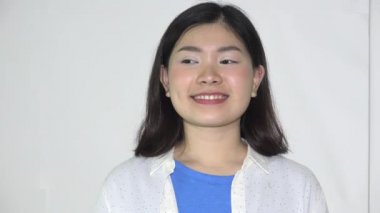 A Happy Asian Female Teen Smiling