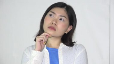A Female Asian Teen Girl Thinking