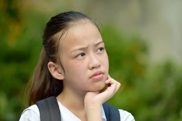 Youthful Asian School Girl Deciding Notebooks — Stock Photo, Image