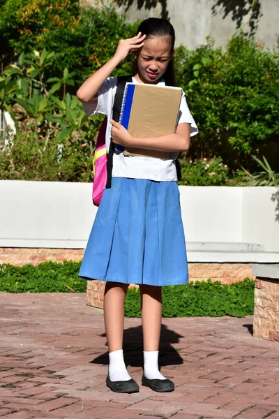 A Stressed Diverse Female Student Standing