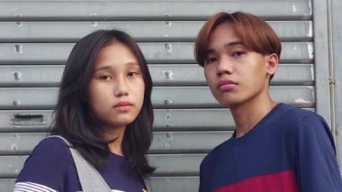 A Serious Unhappy Asian Teen Siblings
