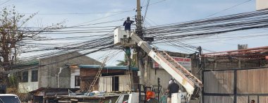 A Philippine Electrician Fixing Wires