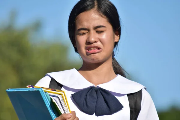 Unhappy Female Student Holding Books — Foto de Stock