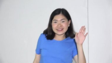 A Happy Asian Woman Dancing