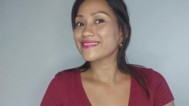 A Smiling Adult Filipina Female Isolated