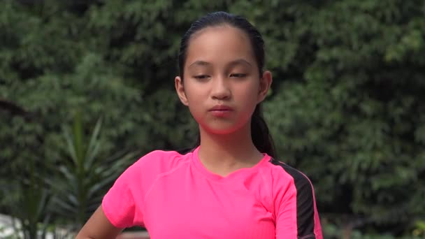 Female Asian Child Athlete Stretching — Stockvideo