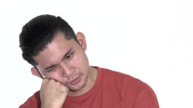 A Sad Tired Asian Man Isolated