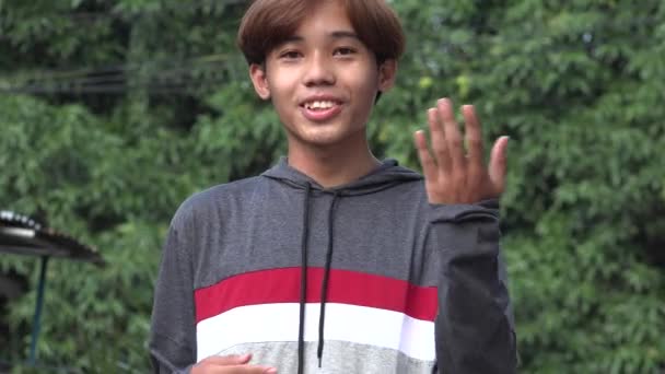 Friendly Asian Male Teen Talking – stockvideo