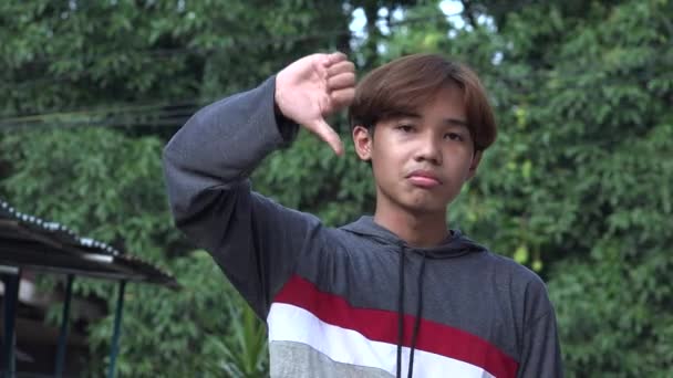 Unhappy Asian Male Teen Thumbs — Αρχείο Βίντεο