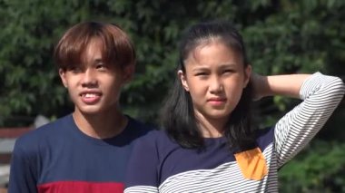 An Asian Siblings Or Friends