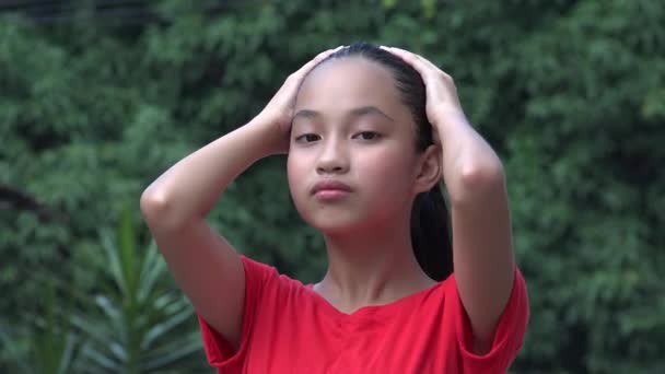 Asian Female Child Touching Hair — Video