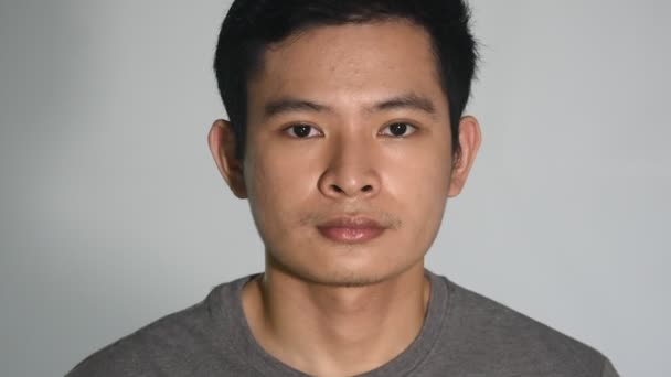 Serious Asian Filipino Man Closeup Isolated — Stockvideo
