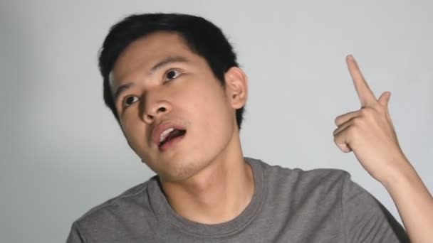 Stupid Asian Man Closeup Isolated — Stockvideo